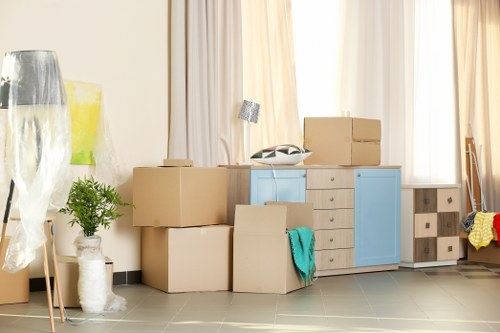 Packed office furniture and equipment prepared for a business move in Harringay