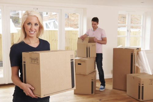 Careful moving of furniture through a narrow flat staircase in Harringay