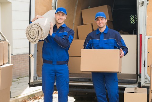 Removal van and moving team working in a Harringay residential street