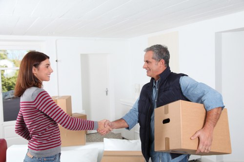 Professional house movers handling furniture during a local Harringay relocation