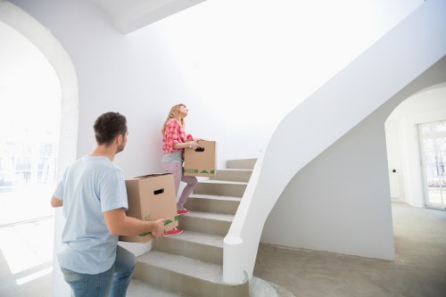 Packed moving boxes and furniture ready for transport during a local house removal
