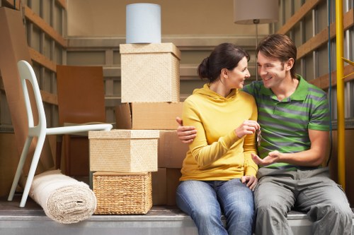 Boxes, wrapped furniture, and moving supplies prepared for a Harringay house relocation