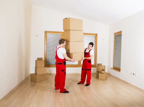 Local movers handling a flat removal with stairs and access challenges