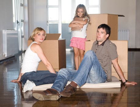 Loading furniture and boxes into a removal truck hire vehicle